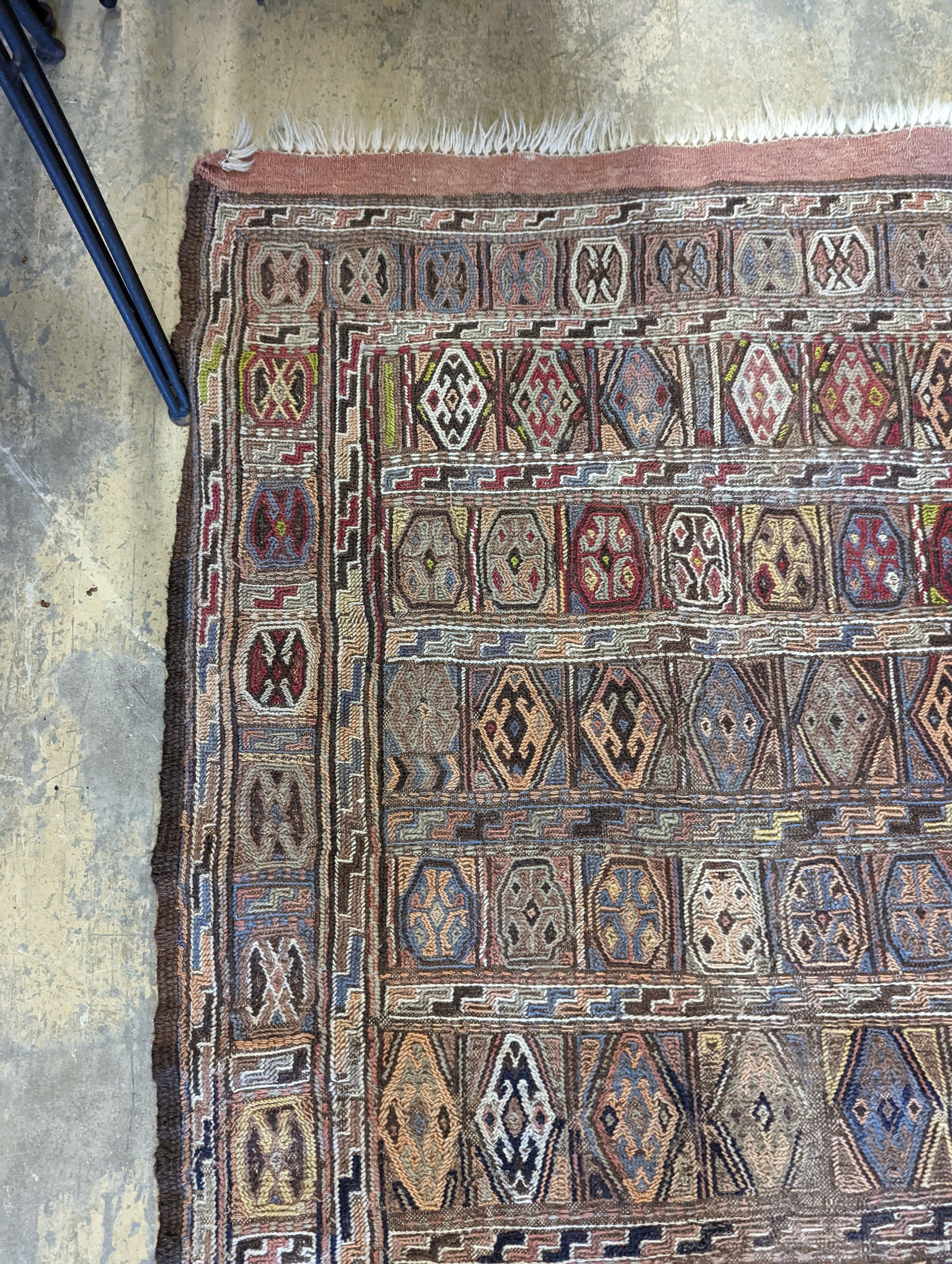 A Sumac flat weave polychrome rug, 180 x 108cm